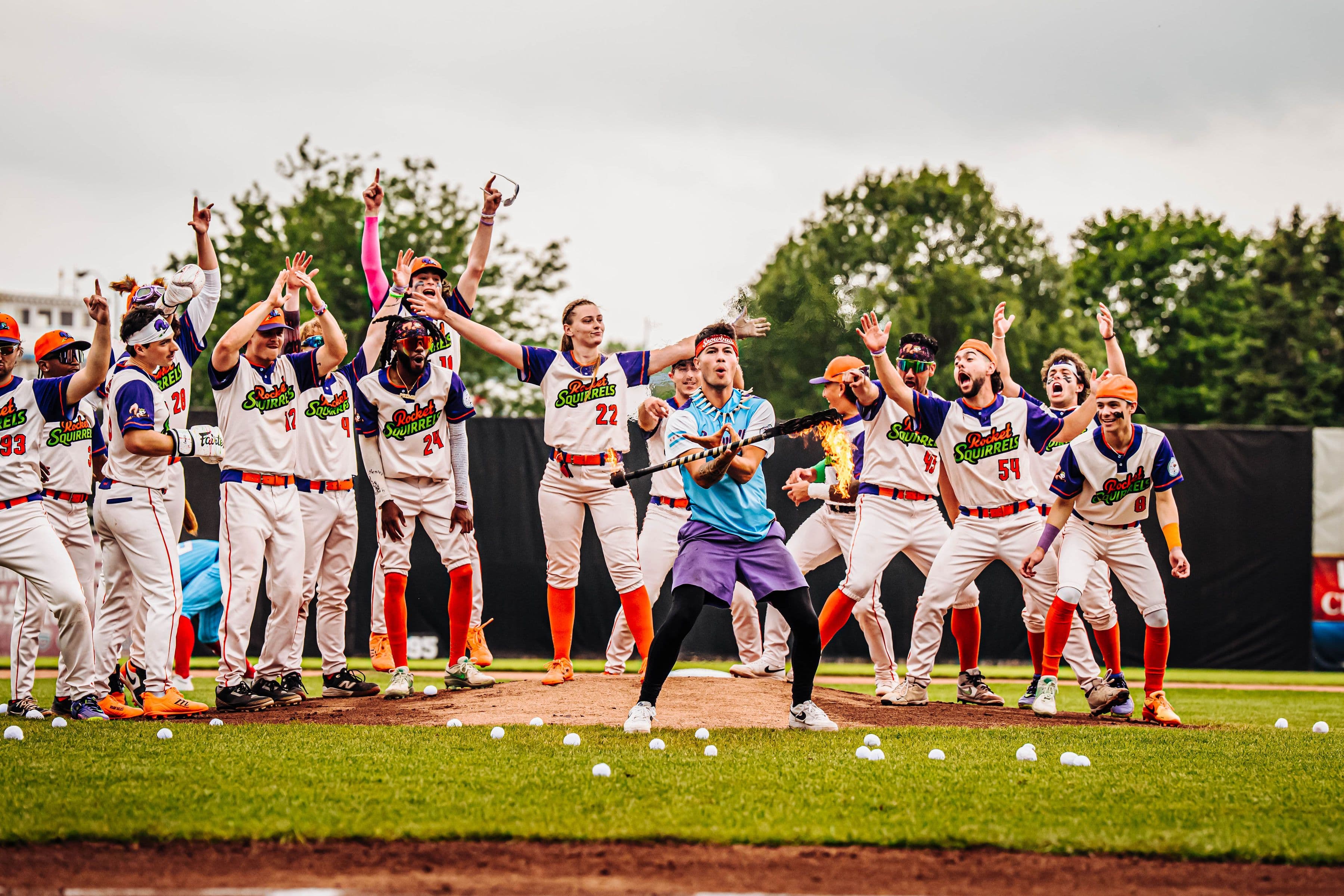 Players cheer with arms raised on the field